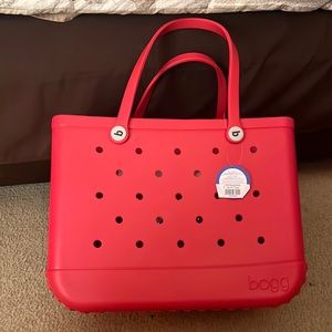 Extra large family Bogg tote bag in red. Can carry beach items, school items.